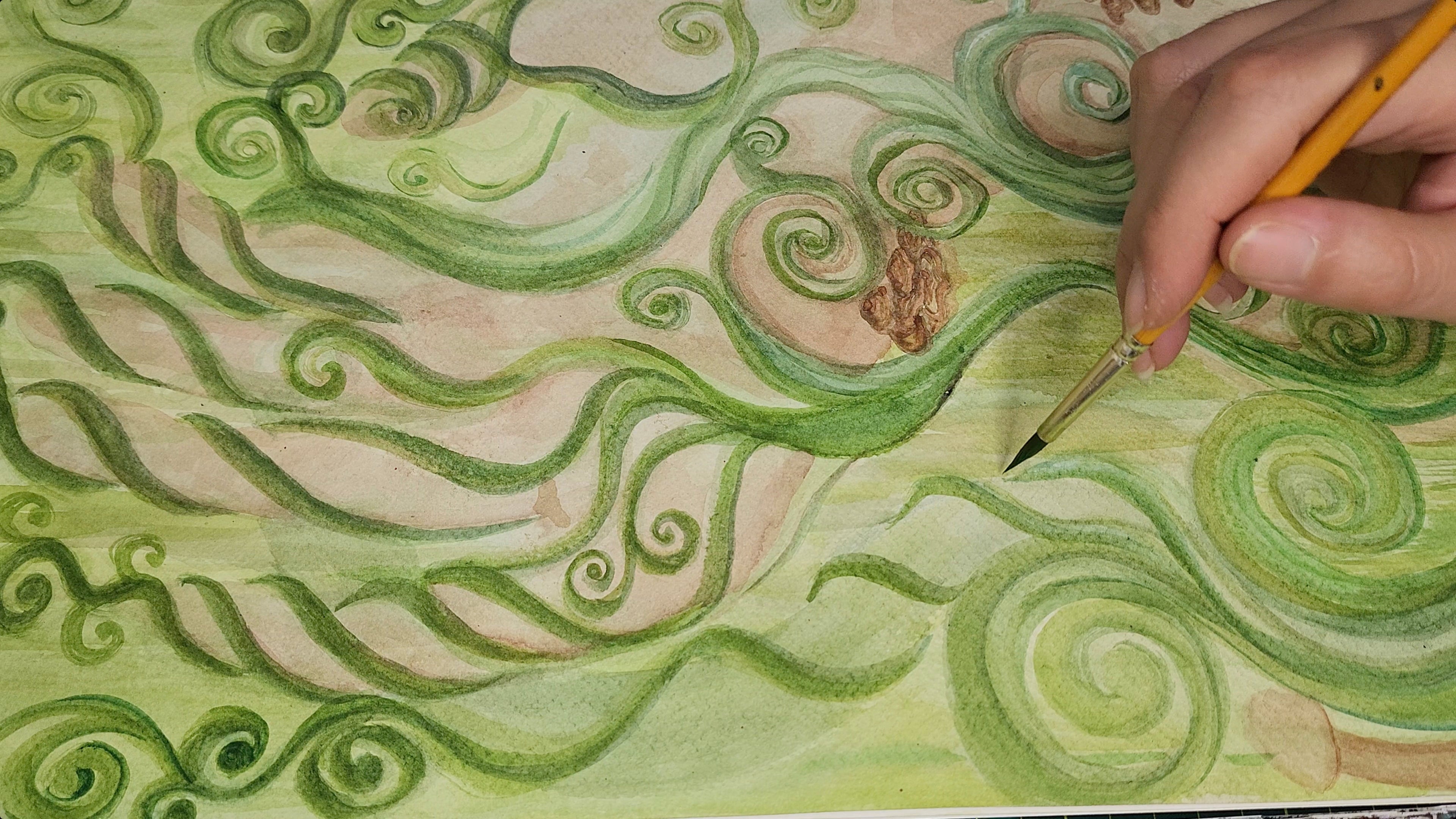 hand with brush painting with watercolors greenery and organic forms